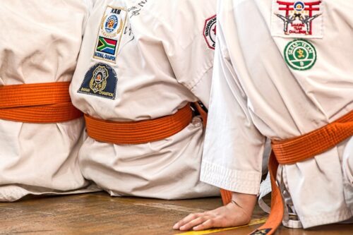 karate uniform athletes sitting 1665747